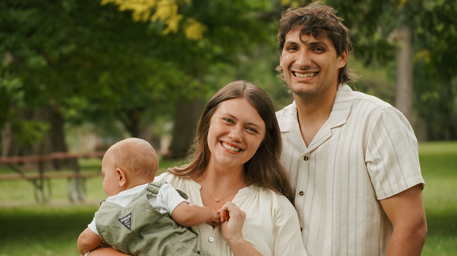 Nathan and Jelaina Decker, founders of Hybrid Reach Media, with their child